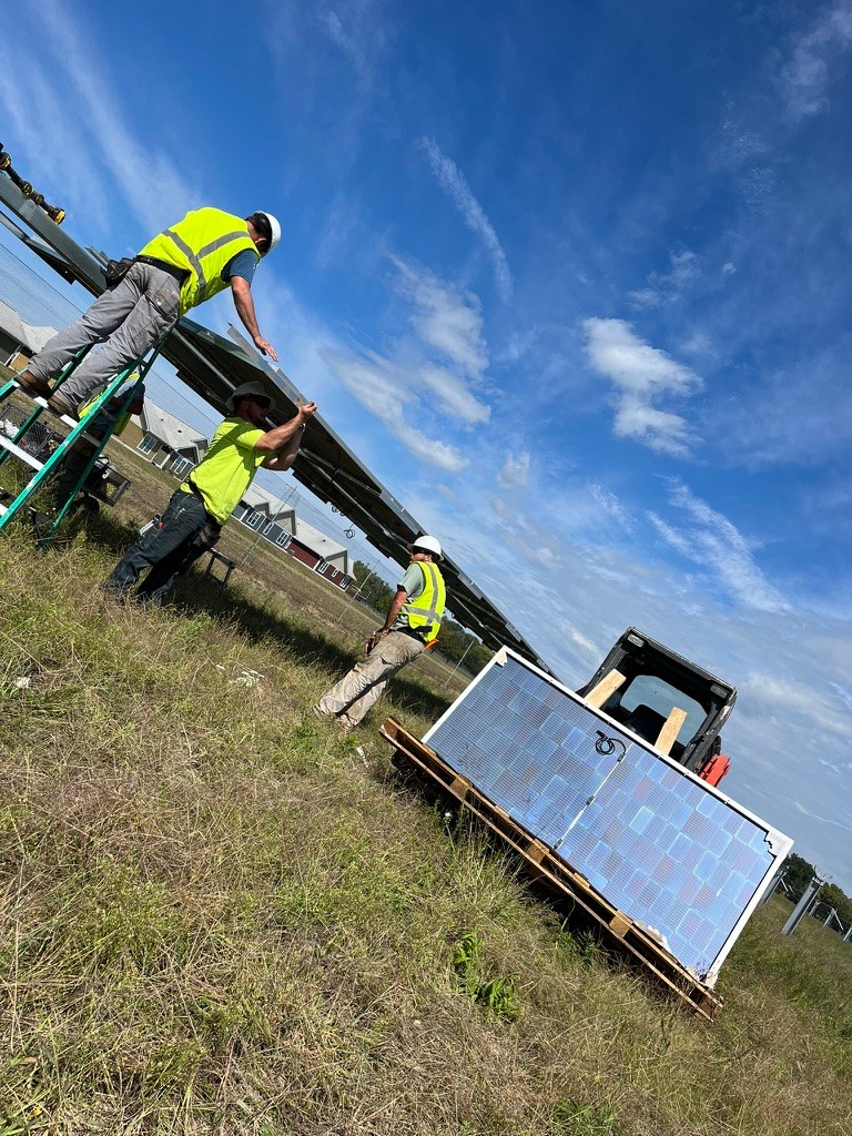 Crew installing solar modules at Havana CDCS