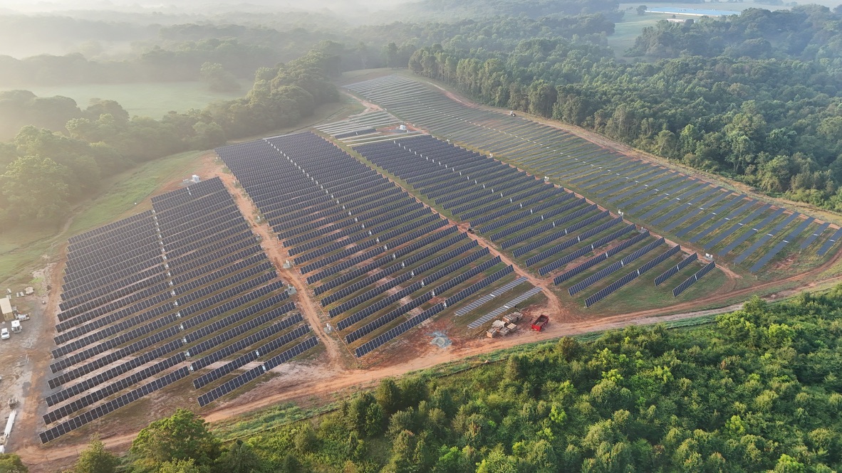Aerial view of the Jackson Bernal solar array surrounded by trees