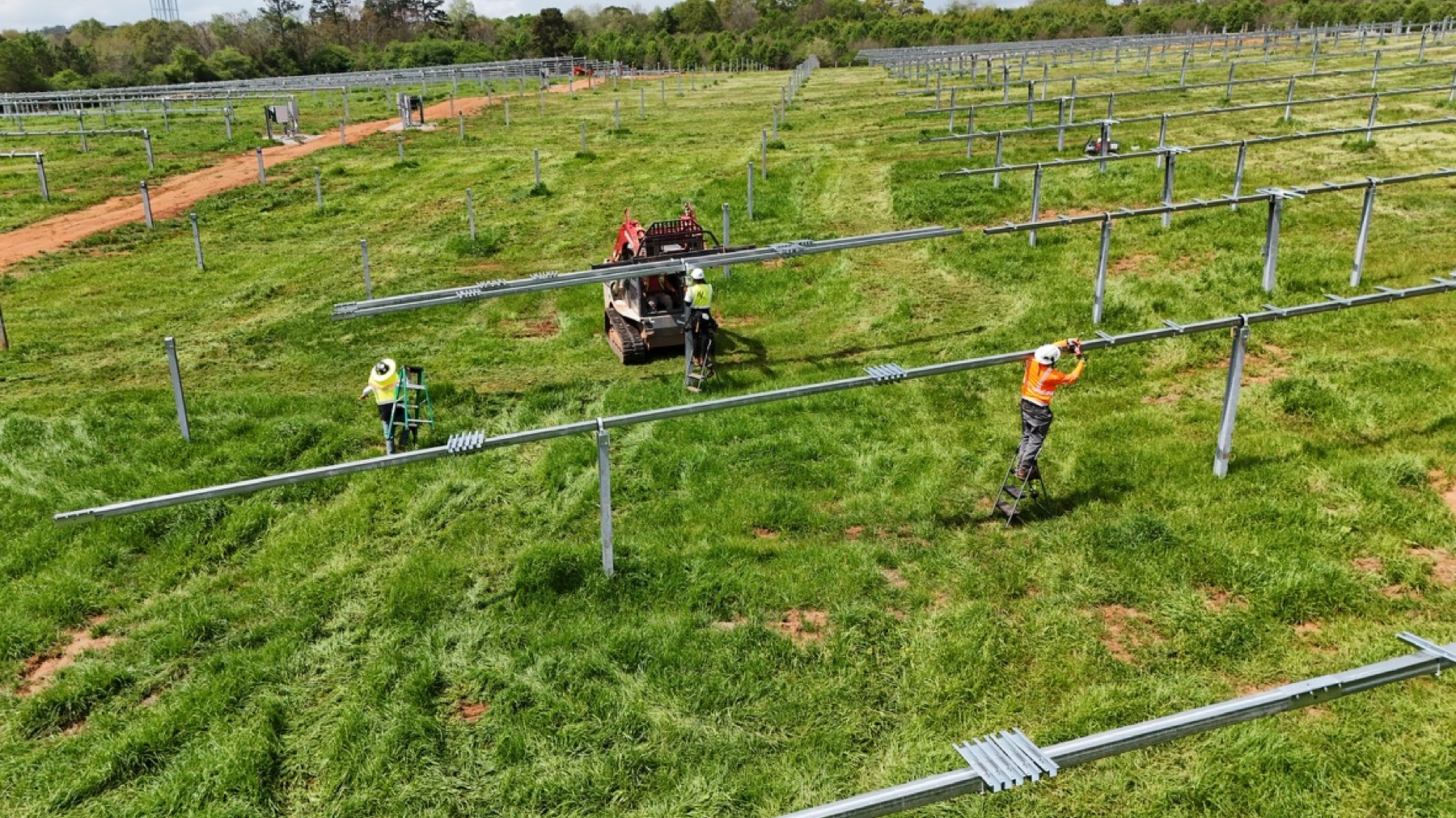 Crew installing racking across the Jackson Bernal site
