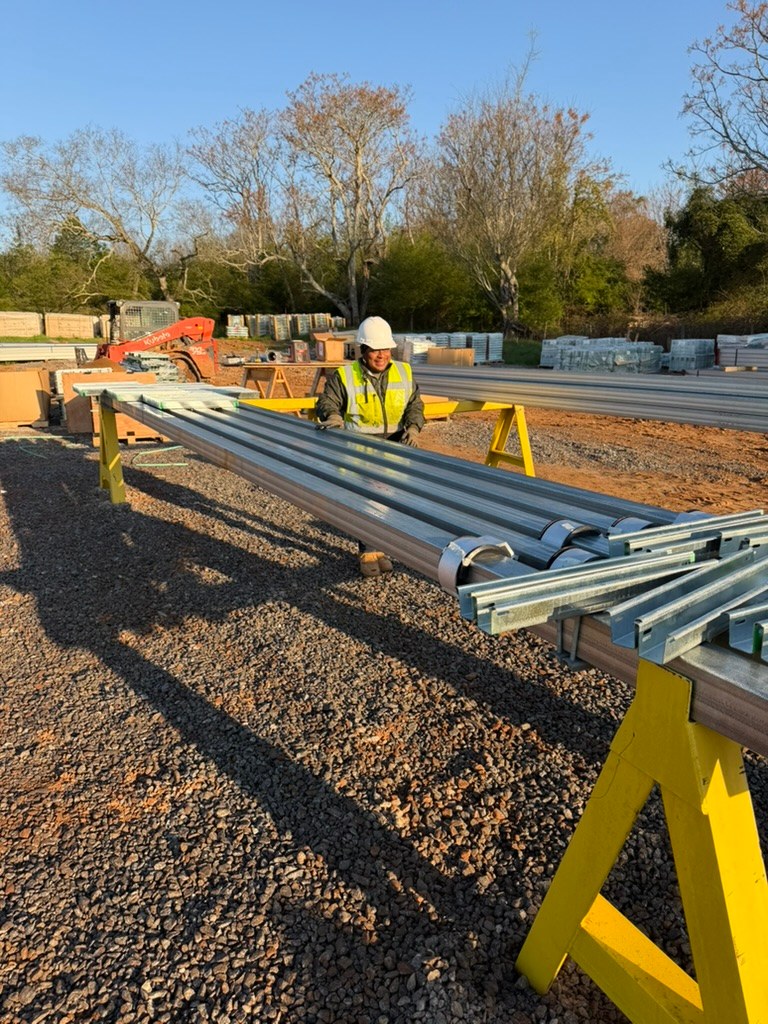 Crew member preparing racking materials