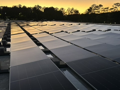 Completed rooftop solar panels at sunset at Ladd Office Park