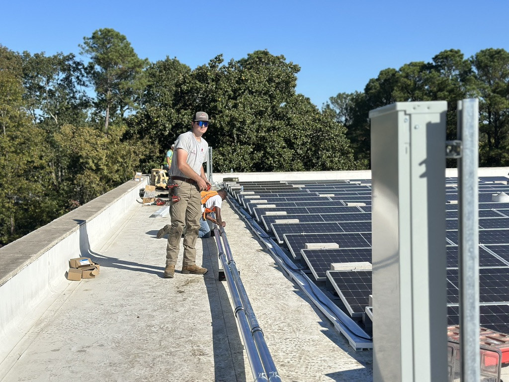 Crew completing rooftop solar installation at Ladd Office Park