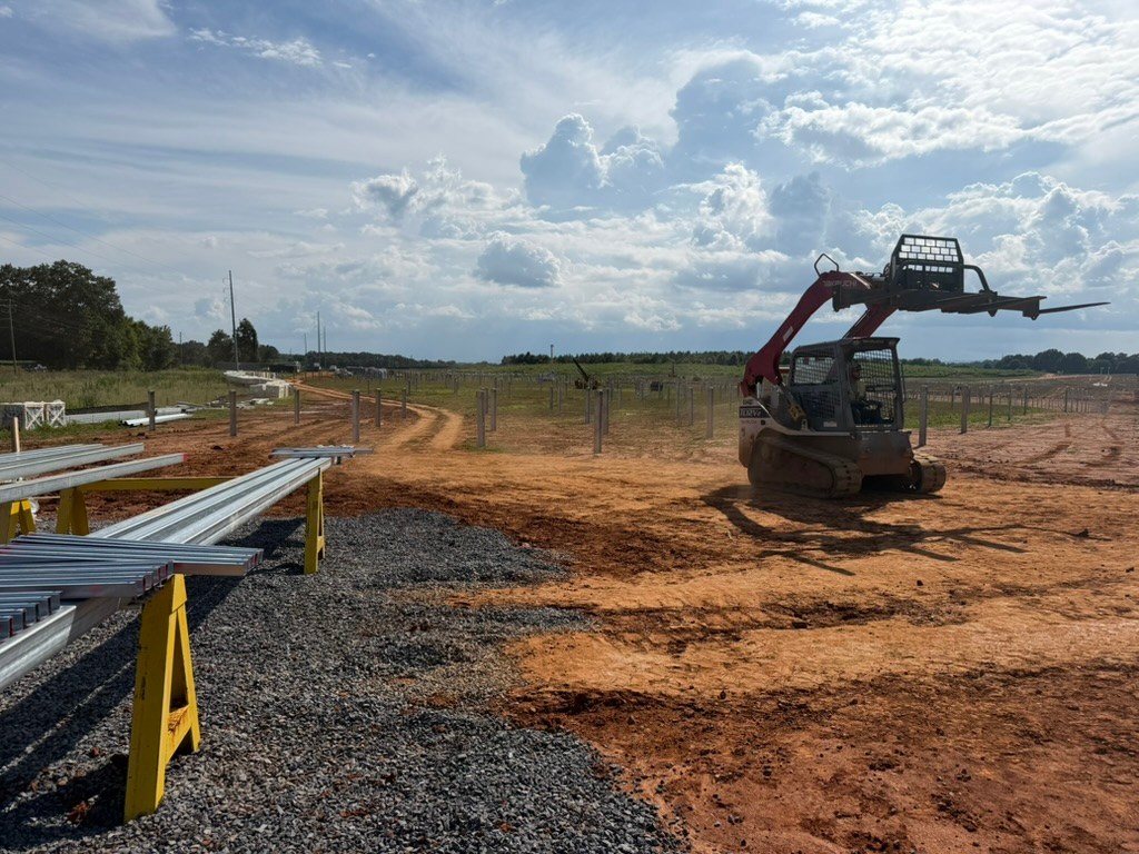 Equipment moving racking materials across the Murray Treadwell site