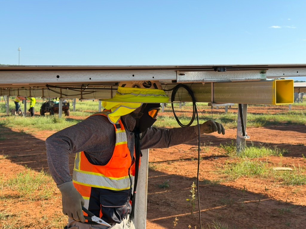 Crew member completing wiring beneath the Murray Treadwell array